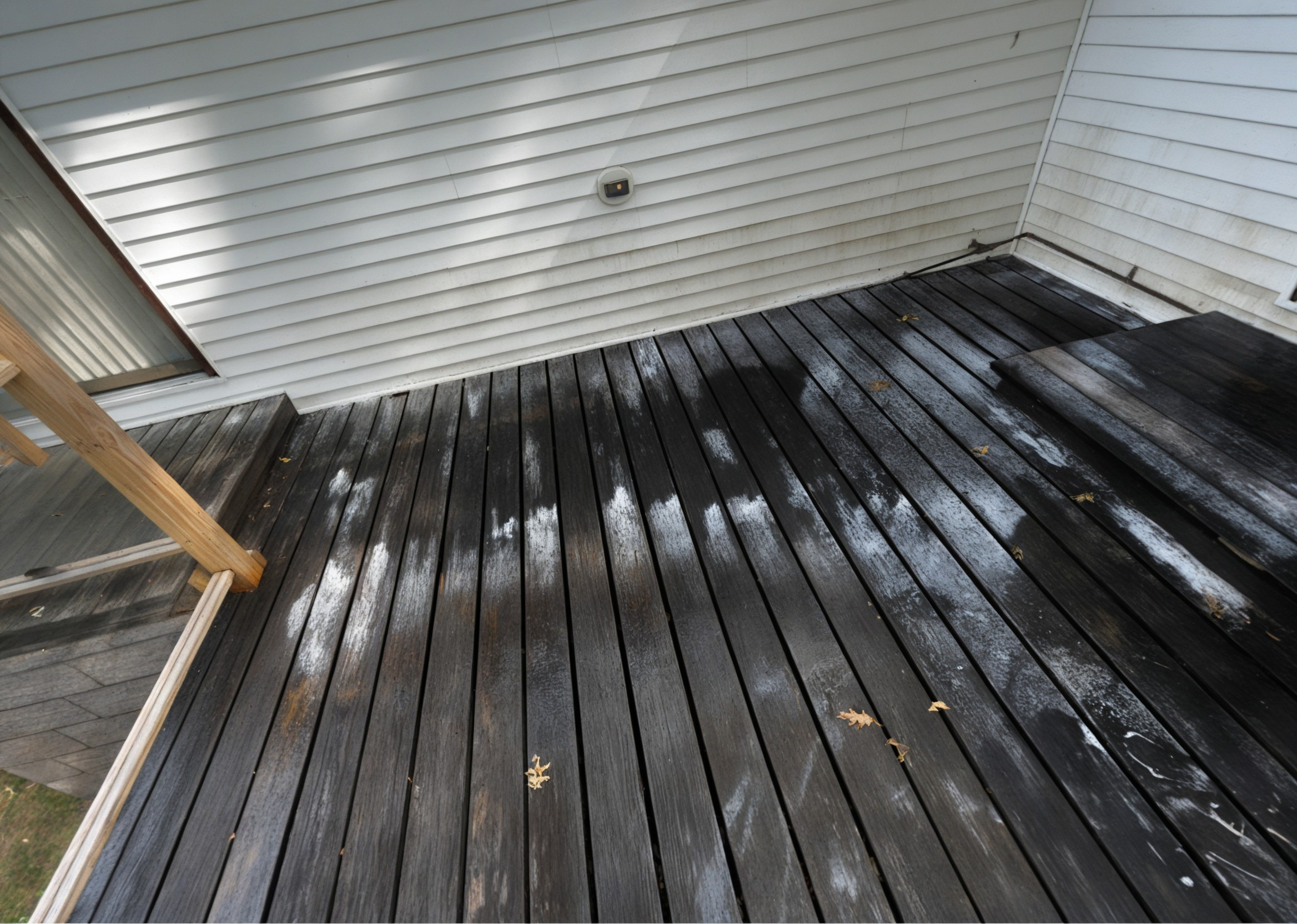 Before: large deck with dark dirty planks
